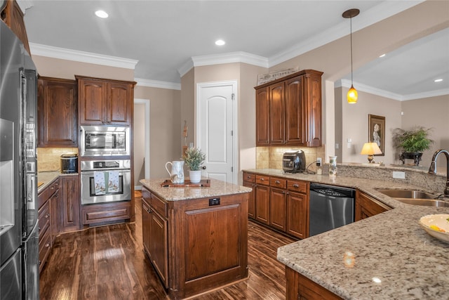 kitchen featuring appliances with stainless steel finishes, light stone countertops, a sink, and dark wood-type flooring