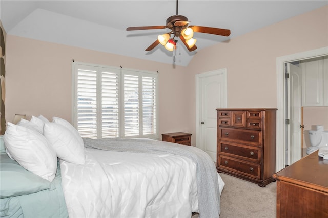 bedroom featuring vaulted ceiling, a ceiling fan, and light colored carpet
