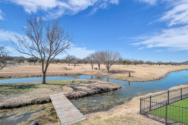 view of water feature featuring fence