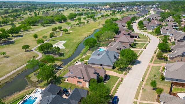 bird's eye view featuring view of golf course, a residential view, and a water view