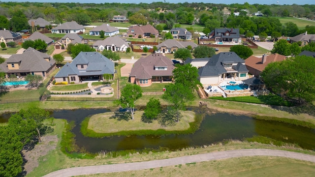 birds eye view of property with a water view and a residential view