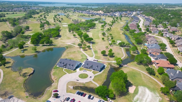 bird's eye view with a residential view and a water view