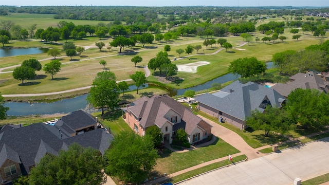 aerial view featuring golf course view, a residential view, and a water view