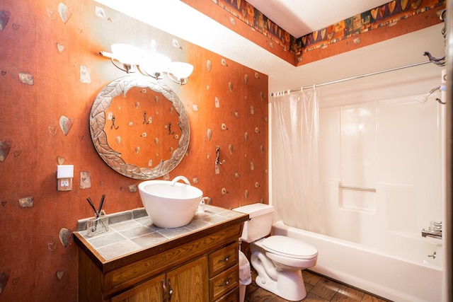 bathroom with shower / bathtub combination with curtain, toilet, and wallpapered walls