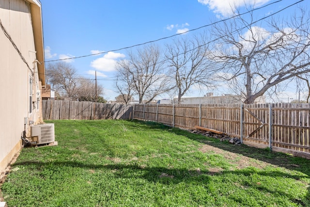 view of yard with cooling unit and a fenced backyard