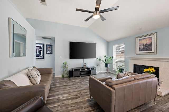 living area with lofted ceiling, a fireplace, visible vents, and dark wood-style flooring