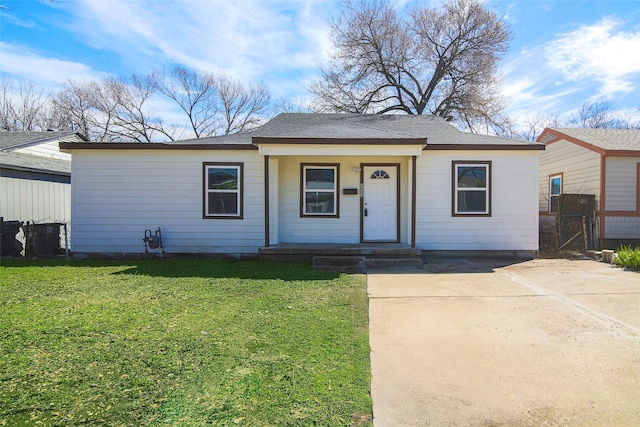 ranch-style house with a porch and a front yard