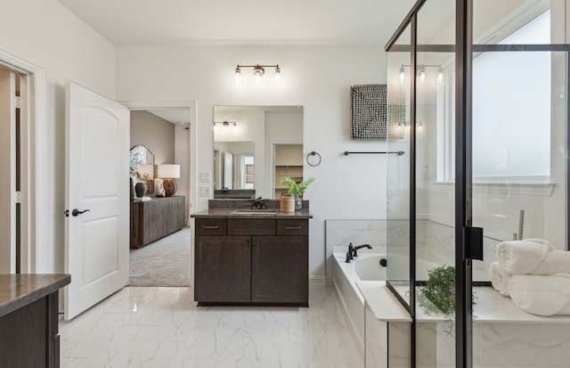 full bath featuring marble finish floor, vanity, a bath, and a shower stall