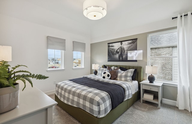 bedroom featuring baseboards and carpet flooring