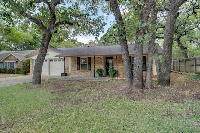 single story home with brick siding, a chimney, concrete driveway, an attached garage, and fence