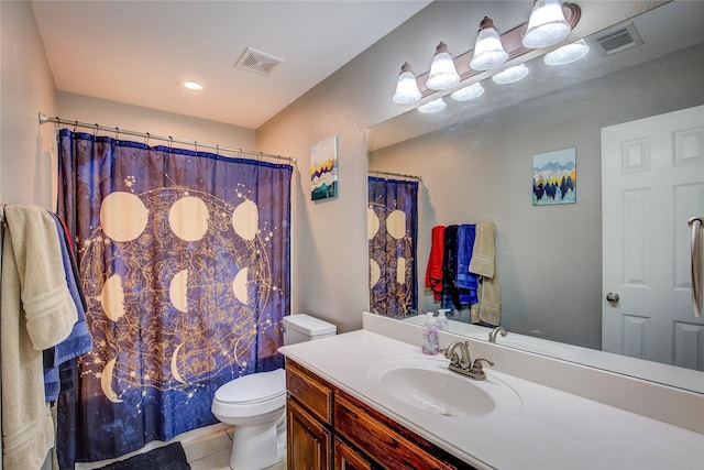 bathroom featuring visible vents, vanity, toilet, and tile patterned floors