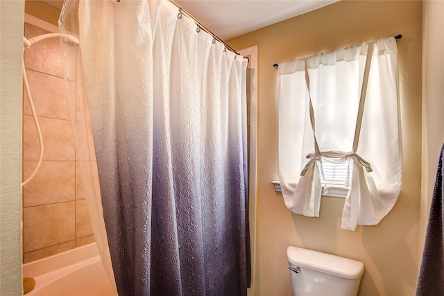 full bath with toilet and a shower with curtain