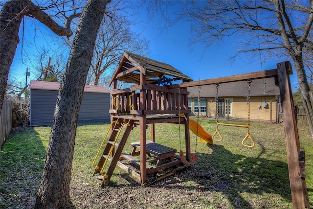 view of play area with a lawn, an outdoor structure, and a fenced backyard