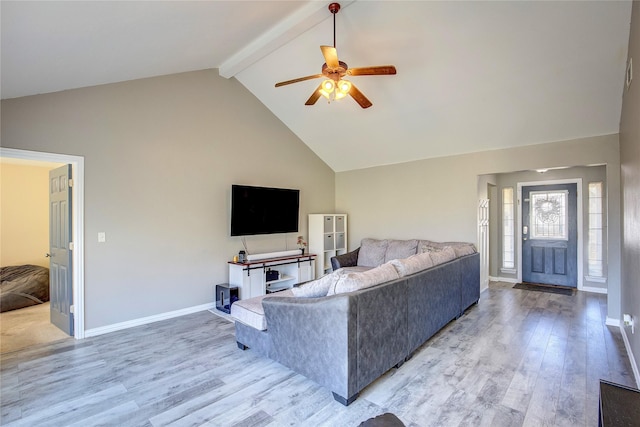 living room with light wood-type flooring, high vaulted ceiling, baseboards, and beam ceiling