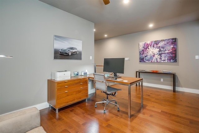 home office featuring a ceiling fan, recessed lighting, baseboards, and wood finished floors