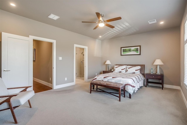 bedroom featuring lofted ceiling, carpet, visible vents, and baseboards