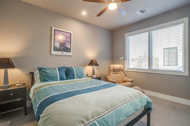 bedroom featuring a ceiling fan, carpet, visible vents, and baseboards