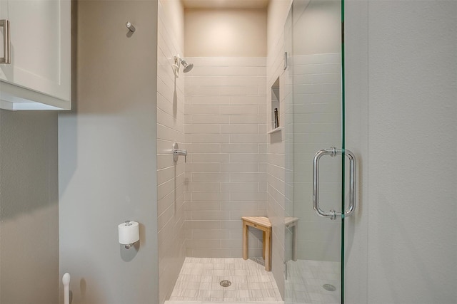 bathroom featuring a shower stall