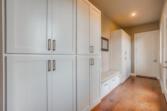 mudroom with light wood-type flooring and recessed lighting