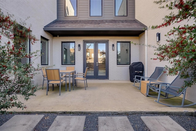 view of patio / terrace featuring french doors and a grill