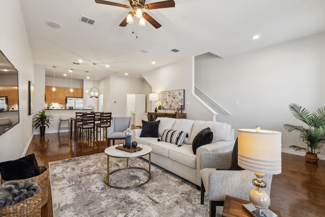 living area featuring visible vents, ceiling fan, recessed lighting, and dark wood-style floors