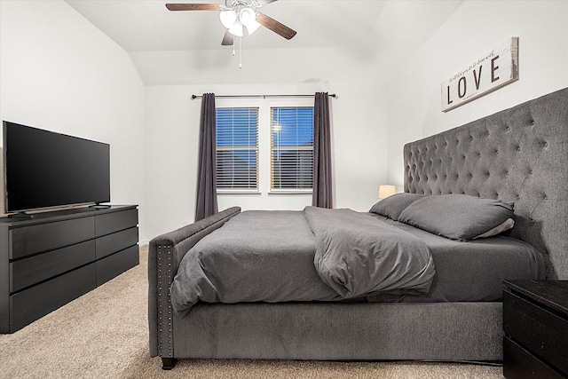 bedroom featuring lofted ceiling, light colored carpet, and ceiling fan