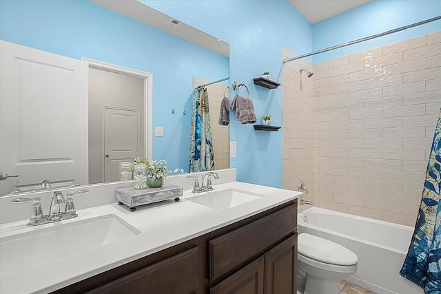 full bath with shower / bath combination with curtain, a sink, toilet, and double vanity