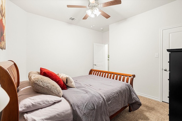 bedroom with carpet floors, visible vents, ceiling fan, and baseboards