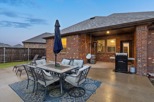 view of patio / terrace with outdoor dining space, fence, and area for grilling