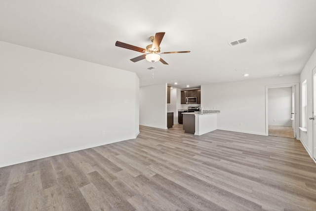 unfurnished living room featuring visible vents, baseboards, ceiling fan, light wood-style floors, and recessed lighting