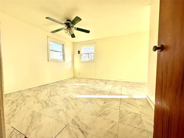 unfurnished room featuring a ceiling fan