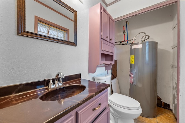 bathroom with a textured wall, tile patterned flooring, toilet, electric water heater, and vanity