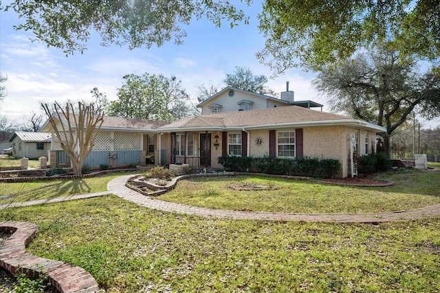 ranch-style house with brick siding and a front lawn