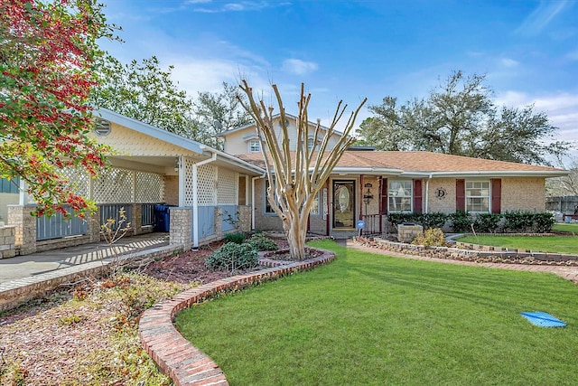 single story home with a front lawn and brick siding