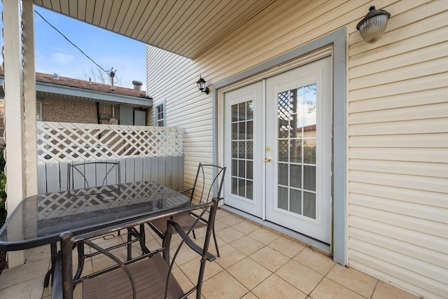 balcony with a patio, french doors, and outdoor dining space