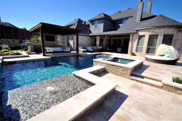 view of swimming pool featuring a pool with connected hot tub, a patio area, fence, and an outdoor living space