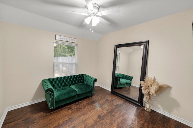 sitting room with lofted ceiling, dark wood-style flooring, a ceiling fan, and baseboards