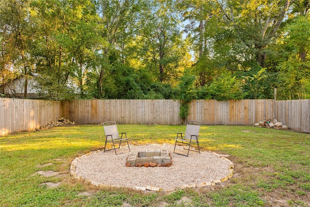 view of yard with an outdoor fire pit and a fenced backyard