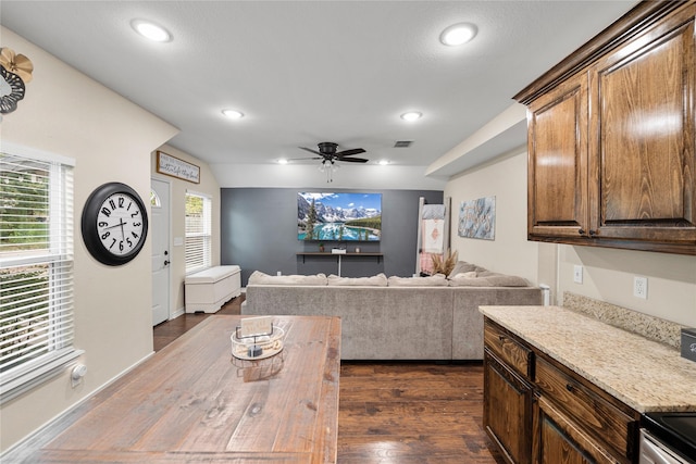 living area featuring visible vents, dark wood finished floors, lofted ceiling, ceiling fan, and recessed lighting