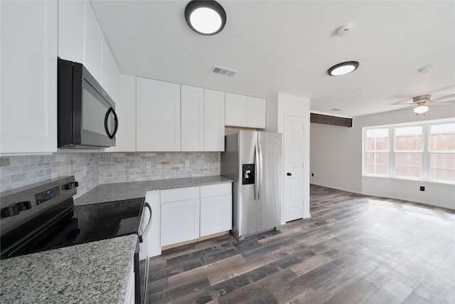 kitchen featuring white cabinetry, visible vents, appliances with stainless steel finishes, and backsplash