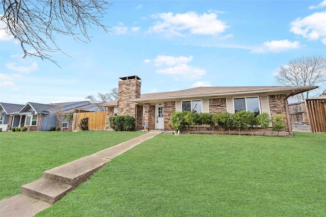 single story home with brick siding, fence, a chimney, and a front lawn