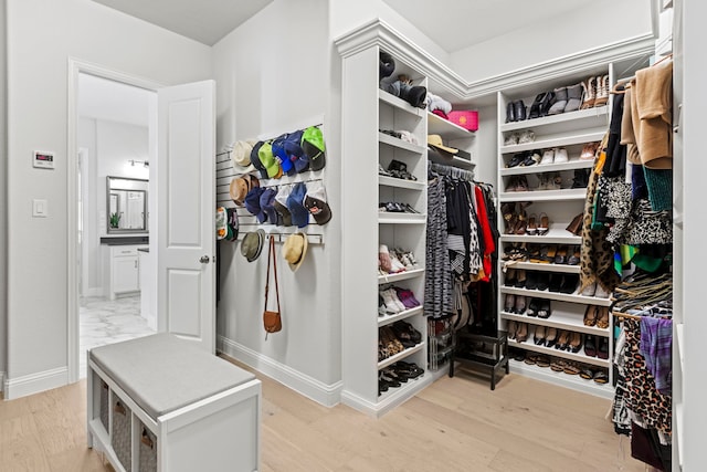 walk in closet featuring light wood-type flooring