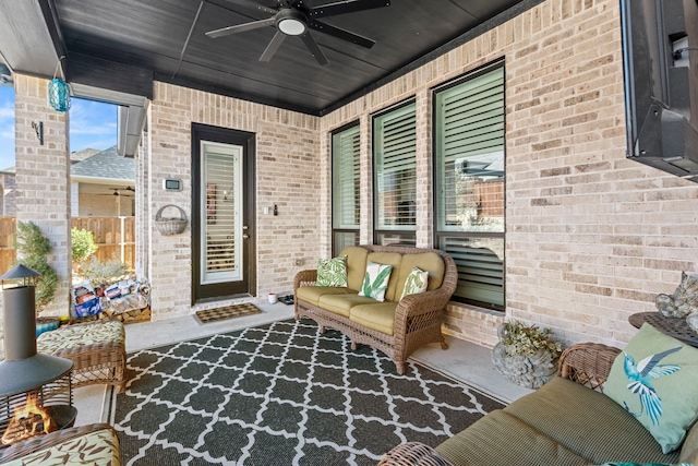 view of patio / terrace with a ceiling fan and an outdoor living space