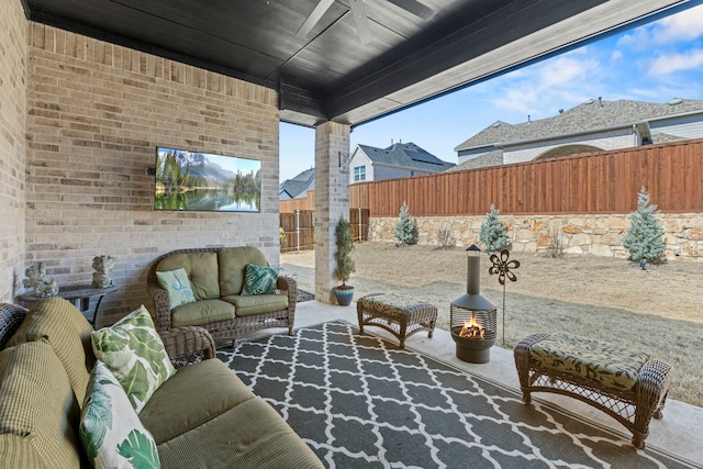 view of patio with a fenced backyard and an outdoor hangout area