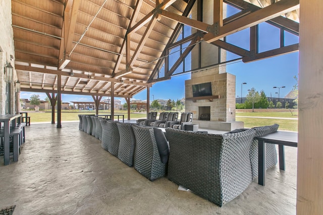 view of patio with an outdoor stone fireplace