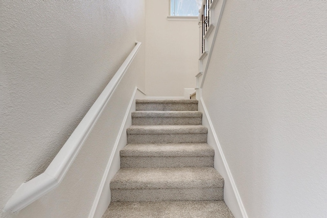 stairs with a textured wall