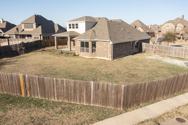 exterior space featuring a fenced backyard and a residential view