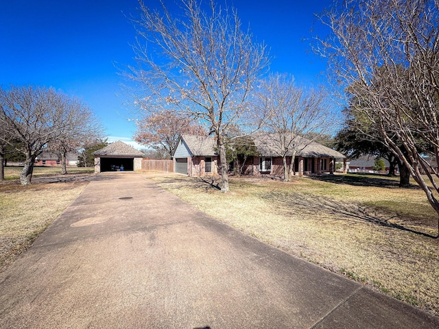 ranch-style house featuring a front lawn