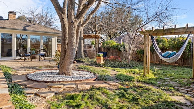 view of yard featuring a patio and fence