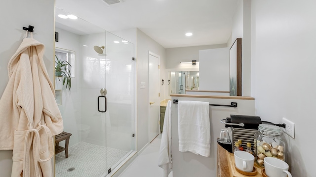 full bath featuring a stall shower, visible vents, and recessed lighting